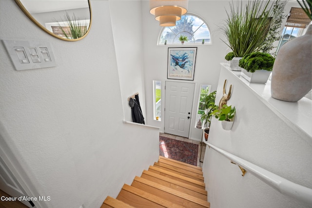 2442 N Rawhide Ridge Rd, Post Falls, ID 83854 - entrance foyer with stairway, wood finished floors, and a textured wall