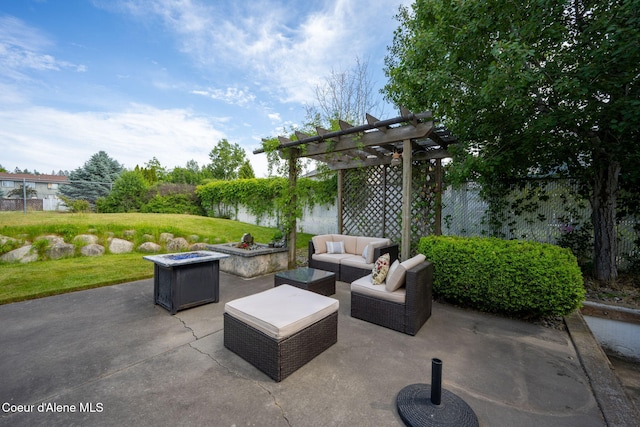 2442 N Rawhide Ridge Rd, Post Falls, ID 83854 - fenced backyard featuring a pergola, a patio area, and an outdoor living space with a fire pit