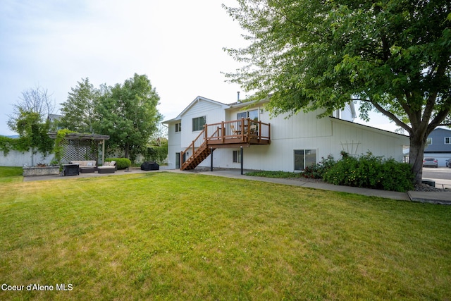 2442 N Rawhide Ridge Rd, Post Falls, ID 83854 - back of house featuring a wooden deck, stairway, a yard, an outdoor living space, and a pergola