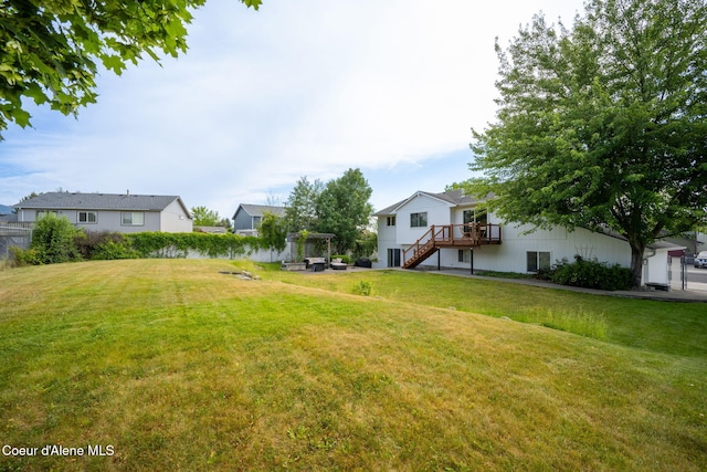 2442 N Rawhide Ridge Rd, Post Falls, ID 83854 - view of green lawn with stairs and a deck