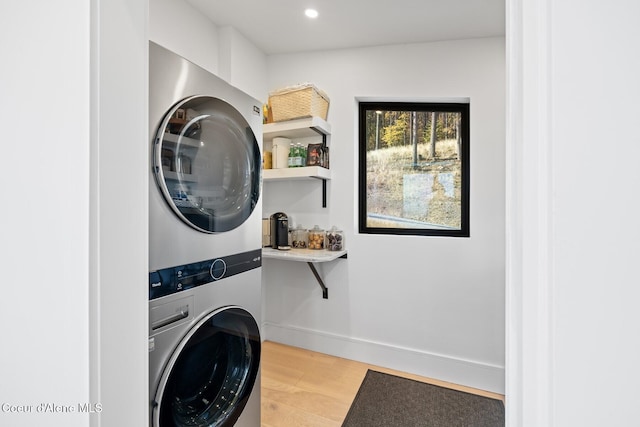 1376 Less Traveled Rd, Sagle, ID 83860 - washroom featuring stacked washer / dryer, light wood-style floors, and recessed lighting
