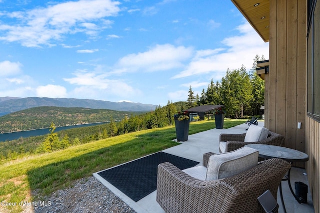 1376 Less Traveled Rd, Sagle, ID 83860 - view of patio featuring a mountain view