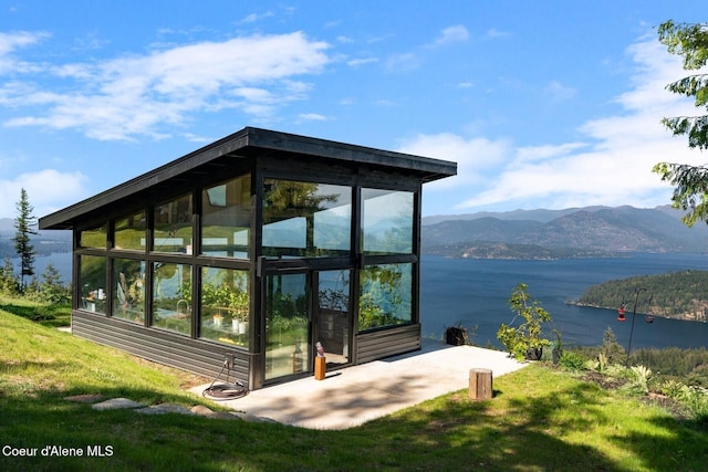 1376 Less Traveled Rd, Sagle, ID 83860 - exterior space with a water and mountain view and a sunroom