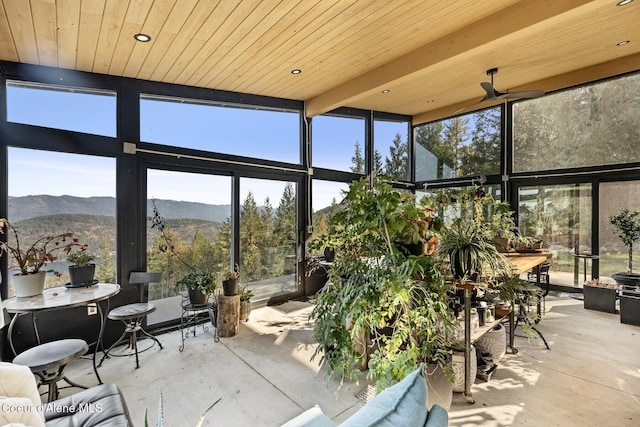 1376 Less Traveled Rd, Sagle, ID 83860 - sunroom / solarium with a wall of windows, unfinished concrete floors, a mountain view, and wood ceiling