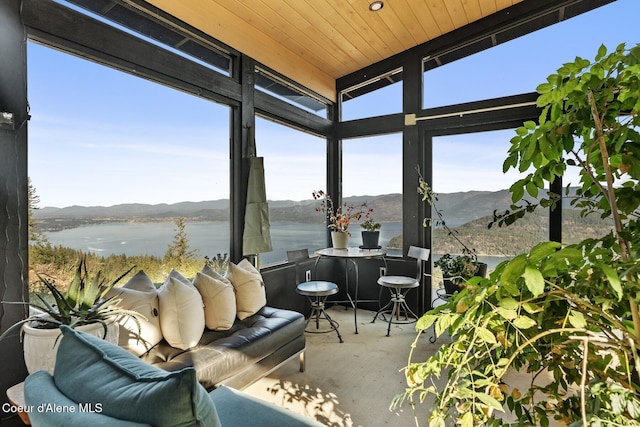1376 Less Traveled Rd, Sagle, ID 83860 - sunroom / solarium featuring expansive windows, a water and mountain view, and wood ceiling