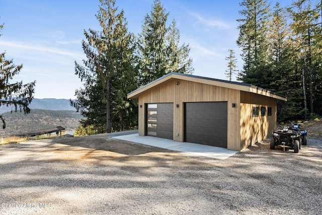 1376 Less Traveled Rd, Sagle, ID 83860 - detached garage featuring a mountain view