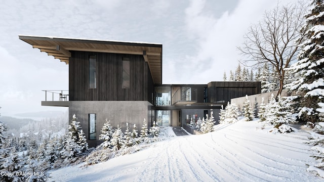 5 Crystal Springs Ct, Sandpoint, ID 83864 - snow covered back of property featuring a balcony