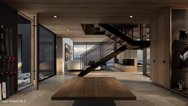 5 Crystal Springs Ct, Sandpoint, ID 83864 - common area with stairs, wooden ceiling, and a wall of windows