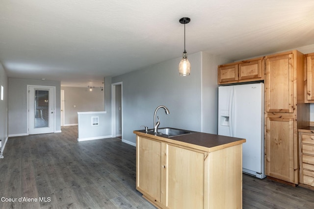 405 W 22nd Ave, Post Falls, ID 83854 - kitchen with white fridge with ice dispenser, light brown cabinets, dark countertops, and dark wood-style floors