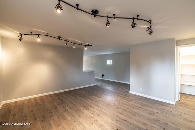 405 W 22nd Ave, Post Falls, ID 83854 - empty room with rail lighting and wood finished floors