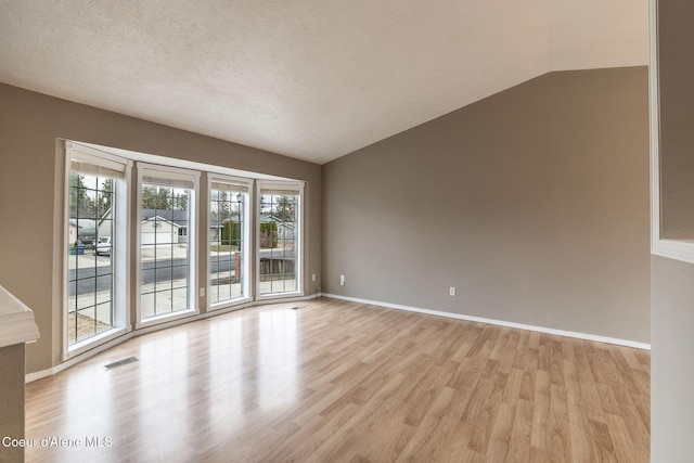 405 W 22nd Ave, Post Falls, ID 83854 - spare room featuring light wood finished floors and lofted ceiling