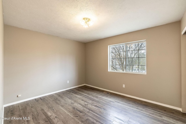 405 W 22nd Ave, Post Falls, ID 83854 - empty room with wood finished floors and a textured ceiling