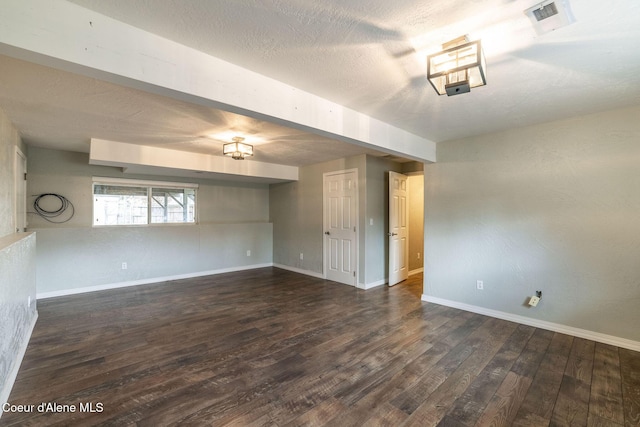 405 W 22nd Ave, Post Falls, ID 83854 - empty room featuring dark wood finished floors and a textured ceiling