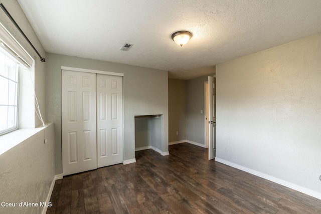 405 W 22nd Ave, Post Falls, ID 83854 - unfurnished bedroom with wood finished floors and a closet