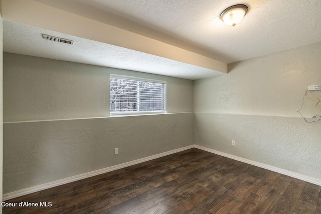 405 W 22nd Ave, Post Falls, ID 83854 - empty room featuring wood-type flooring and a textured wall