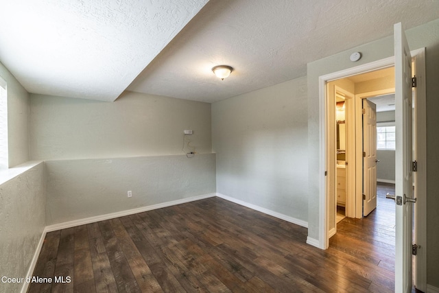 405 W 22nd Ave, Post Falls, ID 83854 - spare room featuring hardwood / wood-style floors, a smoke detector, and a textured ceiling