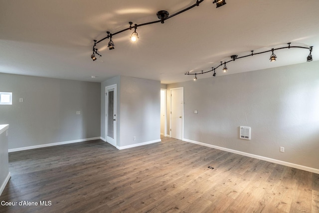 405 W 22nd Ave, Post Falls, ID 83854 - empty room with track lighting and wood finished floors