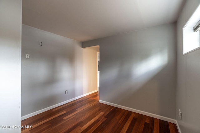 405 W 22nd Ave, Post Falls, ID 83854 - empty room featuring dark wood-style flooring and baseboards