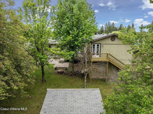 405 W 22nd Ave, Post Falls, ID 83854 - rear view of house with a patio, a wooden deck, french doors, stairway, and a yard