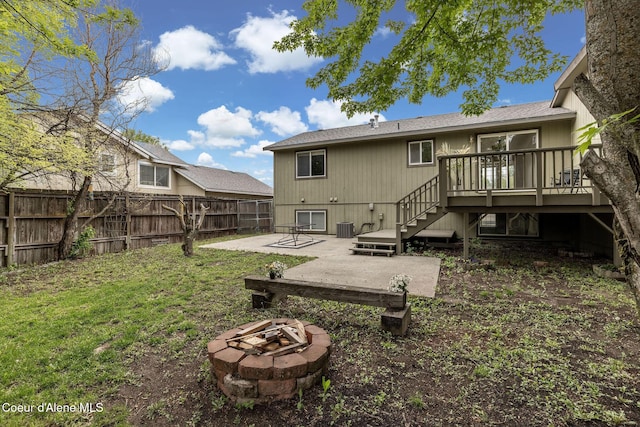 405 W 22nd Ave, Post Falls, ID 83854 - back of property with an outdoor fire pit, a patio area, stairs, a fenced backyard, and a deck