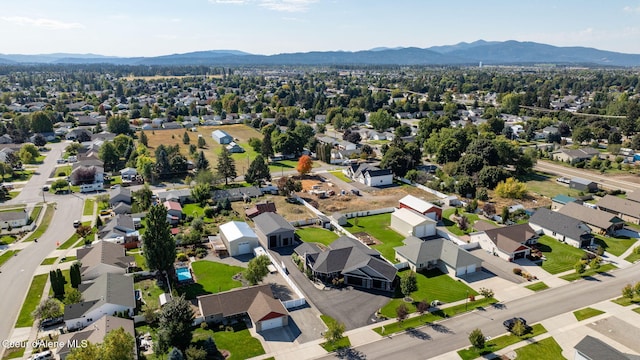 1222 W Tamarindo Ln, Hayden, ID 83835 - aerial perspective of suburban area with a mountainous background