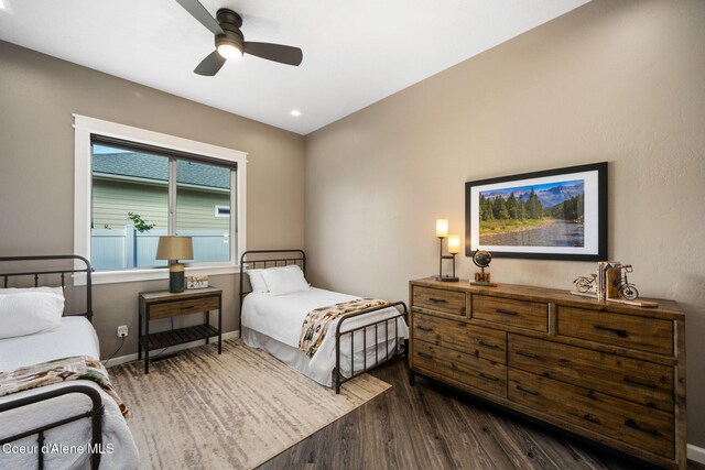 1222 W Tamarindo Ln, Hayden, ID 83835 - bedroom with dark wood-style flooring and ceiling fan