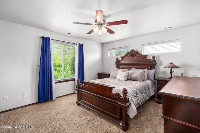 7090 N Epervier Ln, Coeur Dalene, ID 83815 - carpeted bedroom featuring ceiling fan and a textured ceiling