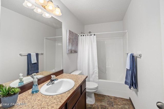 7090 N Epervier Ln, Coeur Dalene, ID 83815 - full bathroom featuring vanity, shower / bath combo with shower curtain, stone finish floors, and a textured ceiling