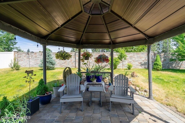 7090 N Epervier Ln, Coeur Dalene, ID 83815 - fenced backyard featuring a gazebo and a patio