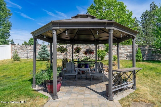 7090 N Epervier Ln, Coeur Dalene, ID 83815 - fenced backyard with a gazebo and a patio