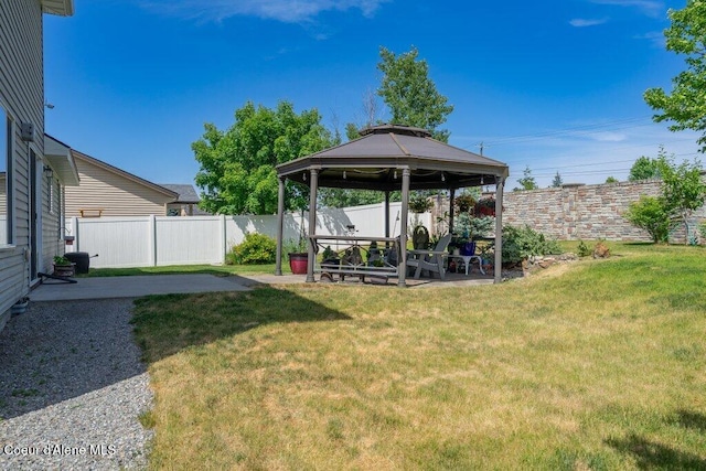 7090 N Epervier Ln, Coeur Dalene, ID 83815 - fenced backyard featuring a gazebo and a patio