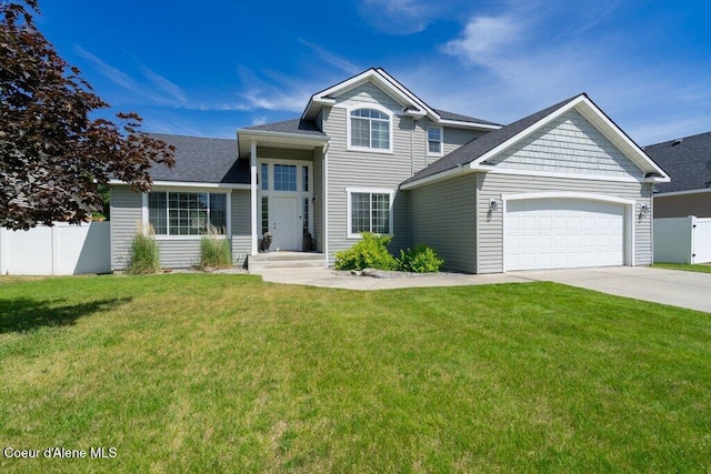 7090 N Epervier Ln, Coeur Dalene, ID 83815 - view of front of home featuring a garage, concrete driveway, and roof with shingles