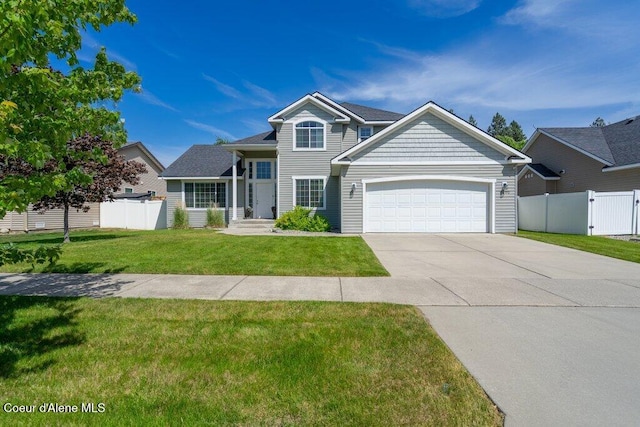7090 N Epervier Ln, Coeur Dalene, ID 83815 - view of front of house with a garage, concrete driveway, and a gate