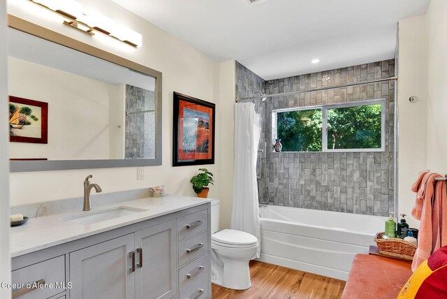 310 W Linden Ave, Coeur Dalene, ID 83814 - full bath with vanity, shower / bathtub combination with curtain, and wood finished floors