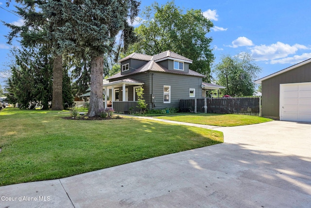 310 W Linden Ave, Coeur Dalene, ID 83814 - view of front of property with concrete driveway, a metal roof, and a garage