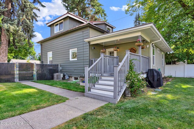 310 W Linden Ave, Coeur Dalene, ID 83814 - bungalow-style house with covered porch and a gate