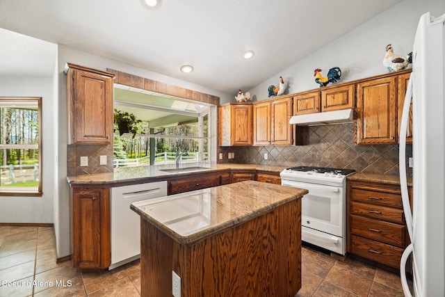 699 W Ranch Ct, Rathdrum, ID 83858 - kitchen with white appliances, under cabinet range hood, healthy amount of natural light, a center island, and recessed lighting