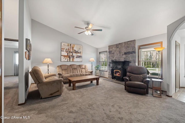 699 W Ranch Ct, Rathdrum, ID 83858 - living room with a ceiling fan, carpet, lofted ceiling, and a lit fireplace