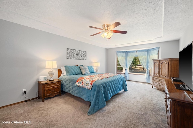 699 W Ranch Ct, Rathdrum, ID 83858 - bedroom featuring carpet, a textured ceiling, and a ceiling fan