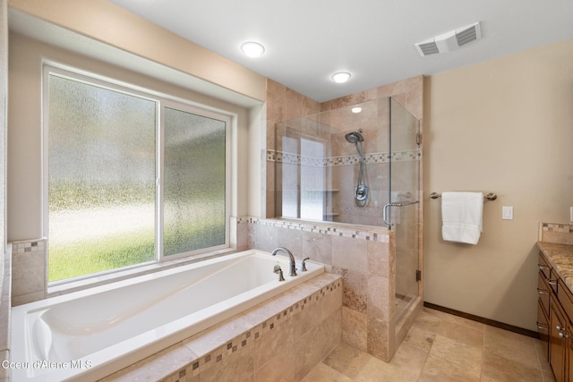699 W Ranch Ct, Rathdrum, ID 83858 - bathroom featuring vanity, a bath, a shower stall, and plenty of natural light