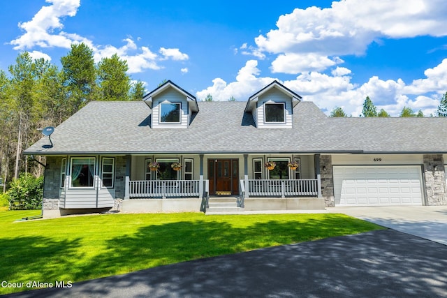 699 W Ranch Ct, Rathdrum, ID 83858 - cape cod house with stone siding, driveway, a porch, and an attached garage