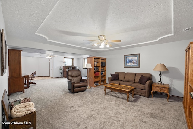 699 W Ranch Ct, Rathdrum, ID 83858 - living room featuring ceiling fan, a textured ceiling, and light carpet
