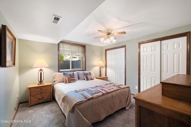 699 W Ranch Ct, Rathdrum, ID 83858 - bedroom featuring light carpet, two closets, and ceiling fan