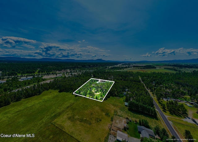 699 W Ranch Ct, Rathdrum, ID 83858 - aerial view of property's location featuring property boundaries highlighted and a mountain backdrop