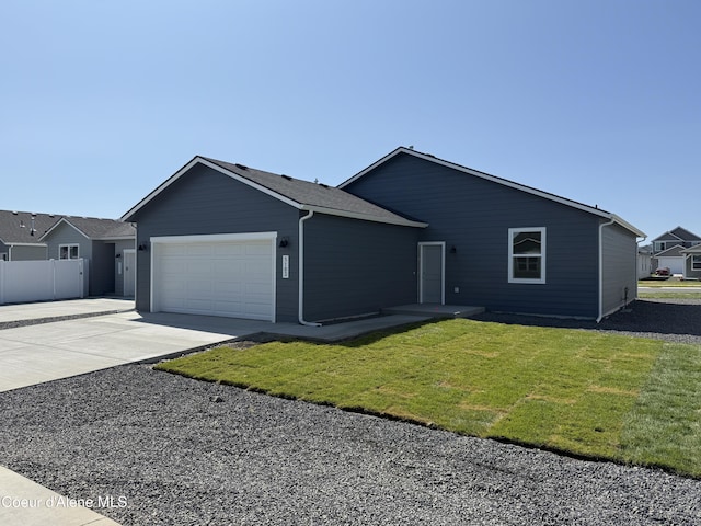 5103 E Rigel Ln, Post Falls, ID 83854 - ranch-style home with a garage and concrete driveway