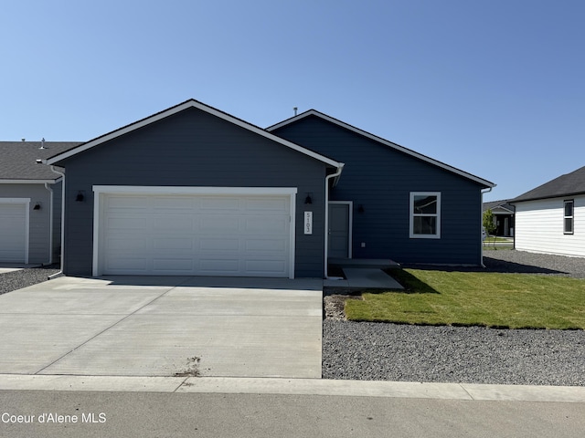 5103 E Rigel Ln, Post Falls, ID 83854 - single story home with driveway, an attached garage, and a front yard