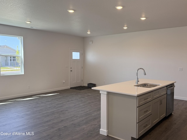 5103 E Rigel Ln, Post Falls, ID 83854 - kitchen with dishwasher, dark wood finished floors, a center island with sink, plenty of natural light, and recessed lighting