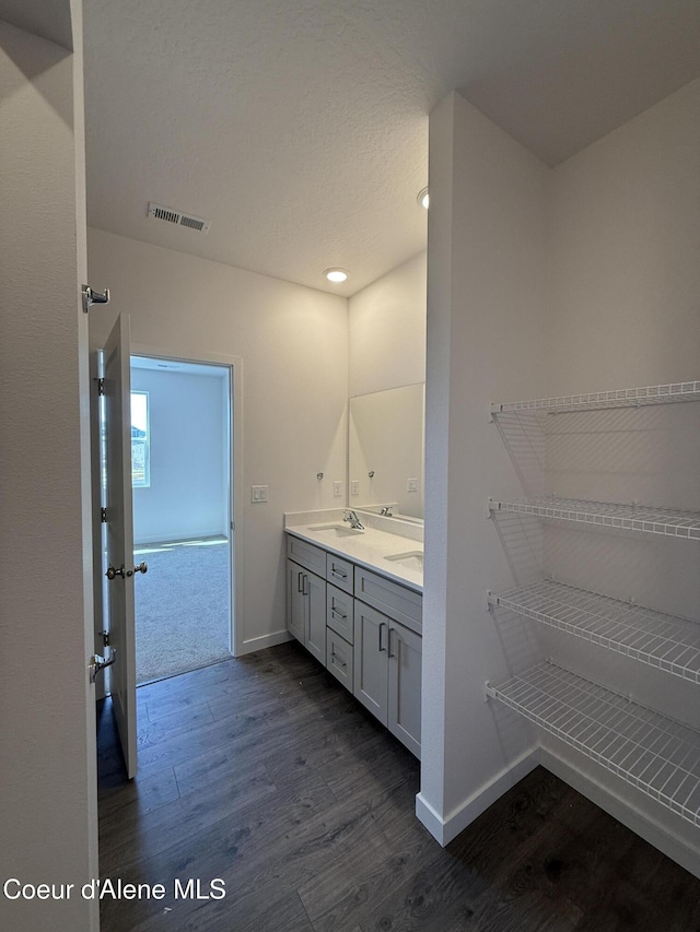 5103 E Rigel Ln, Post Falls, ID 83854 - full bath with wood finished floors, double vanity, and recessed lighting