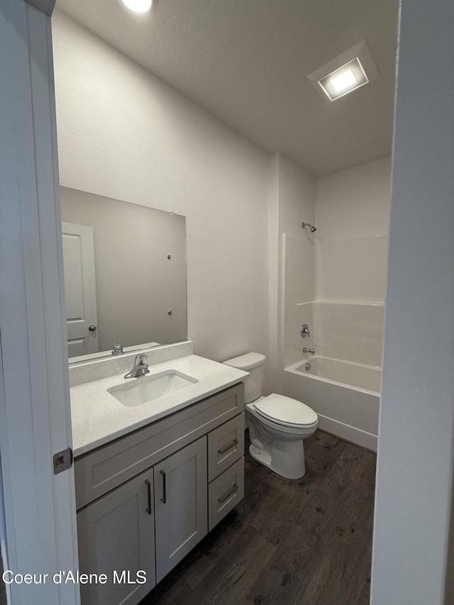 5103 E Rigel Ln, Post Falls, ID 83854 - full bathroom with wood finished floors, vanity, and bathing tub / shower combination
