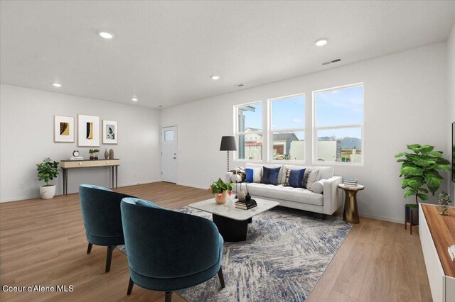 5103 E Norma Ave, Post Falls, ID 83854 - living room featuring light wood-type flooring and recessed lighting